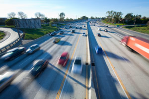 cars speeding on the highway