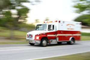 blurred daytime image of ambulance enroute 