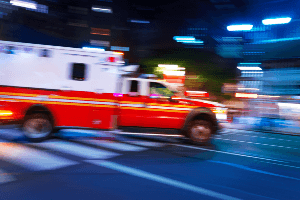 ambulance with flashing lights at night