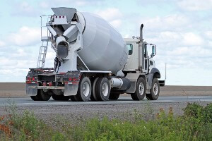 cement truck on highway against blue sky
