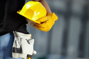 construction worker holding helmet