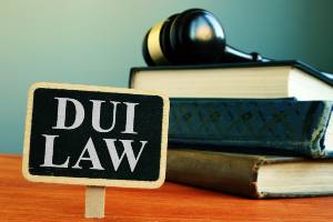 law books with sign saying DUI law