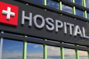 hospital sign in front of blue sky