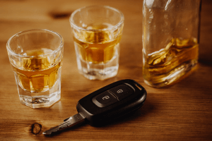 Car keys and alcohol glasses