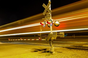 train crossing railroad tracks at night