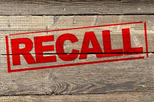 recall stamped onto wooden background