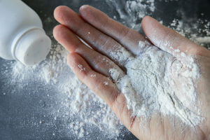 talcum-based powder in hand