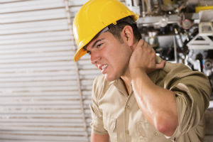 construction worker clutching neck